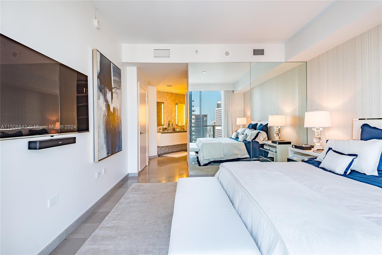 88 Southwest 7th Street, Unit 3301 Miami, FL 33130 - Photo 23 of 54 a bed room with two bed and a television