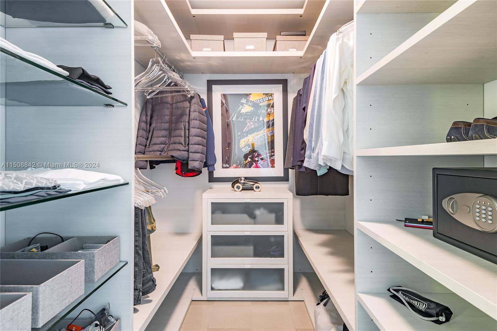88 Southwest 7th Street, Unit 3301 Miami, FL 33130 - Photo 24 of 54 a view of walk in closet with clothes and shoes