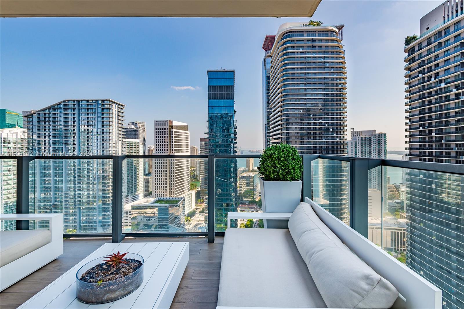 88 Southwest 7th Street, Unit 3301 Miami, FL 33130 - Photo 33 of 54 a balcony with wooden floor