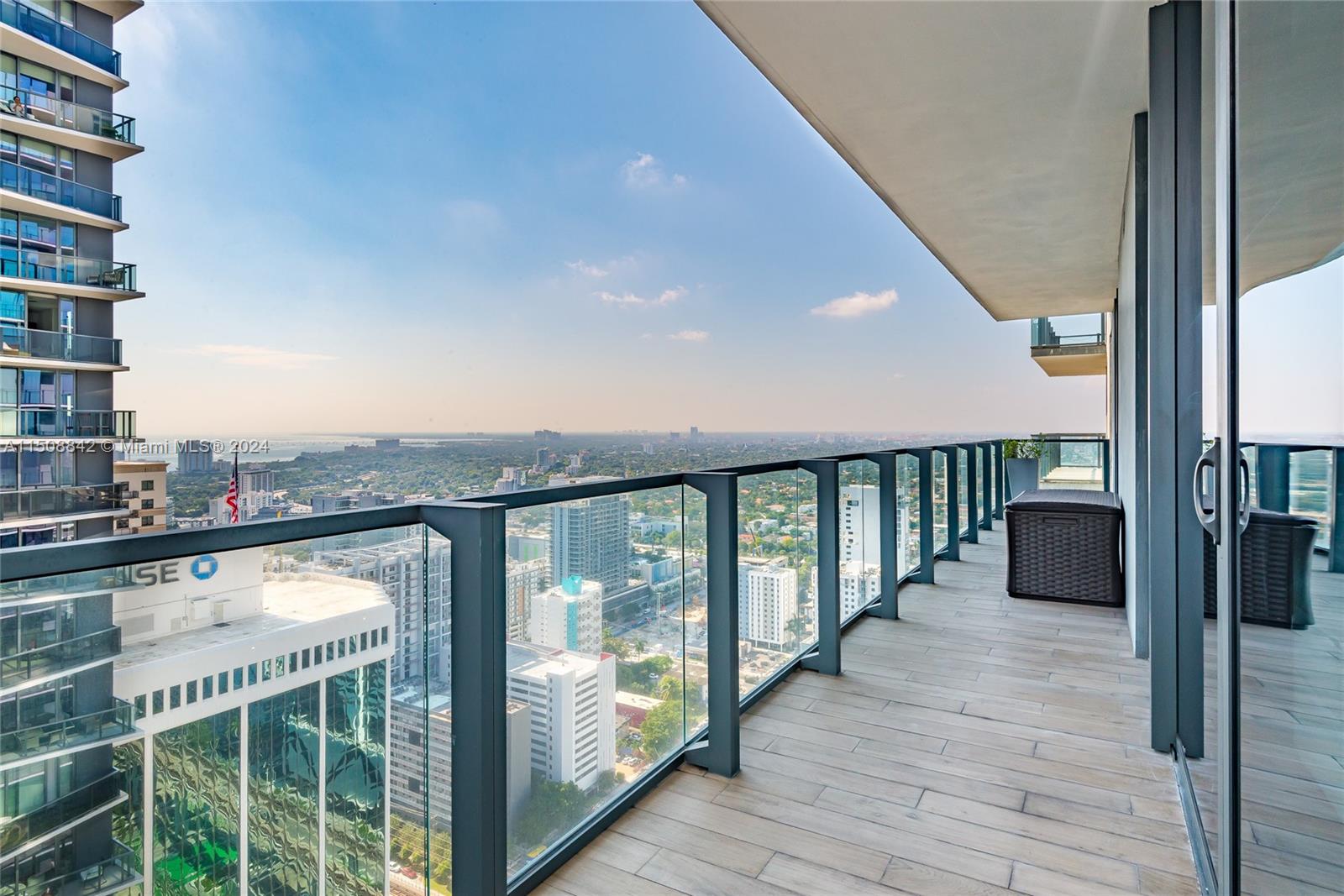 88 Southwest 7th Street, Unit 3301 Miami, FL 33130 - Photo 37 of 54 a view of a balcony with an ocean view