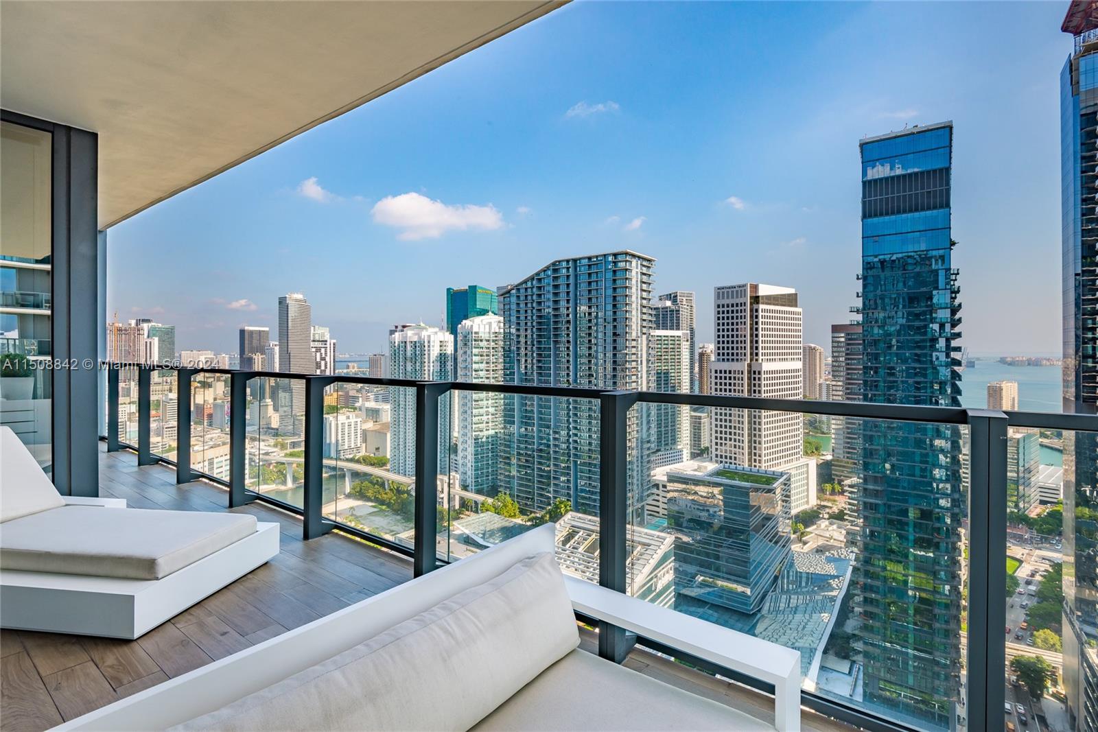 88 Southwest 7th Street, Unit 3301 Miami, FL 33130 - Photo 40 of 54 a view of a balcony with chairs