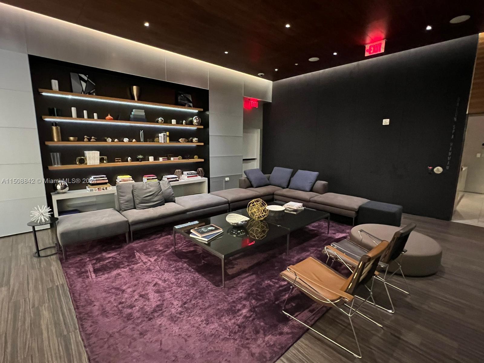 88 Southwest 7th Street, Unit 3301 Miami, FL 33130 - Photo 54 of 54 a living room with furniture and a rug