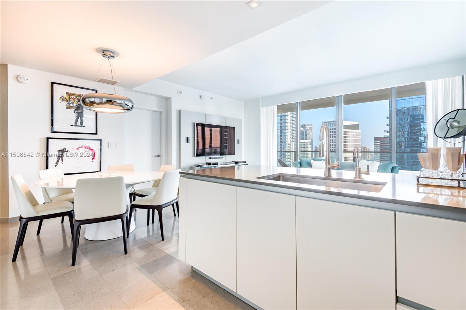88 Southwest 7th Street, Unit 3301 Miami, FL 33130 - Photo 8 of 54 a dining room with a table chairs and entryway