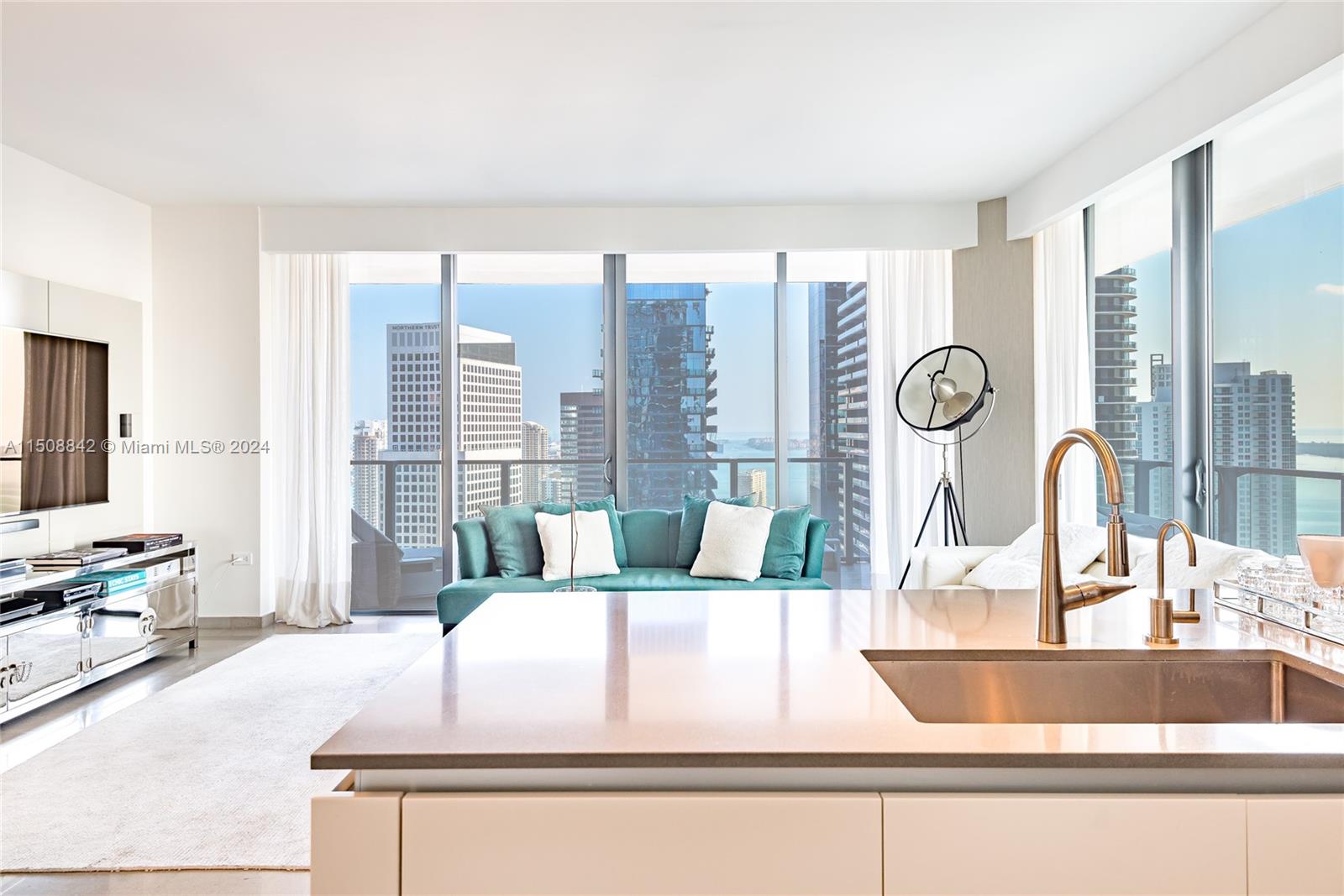 88 Southwest 7th Street, Unit 3301 Miami, FL 33130 - Photo 10 of 54 a living room with furniture and a large window