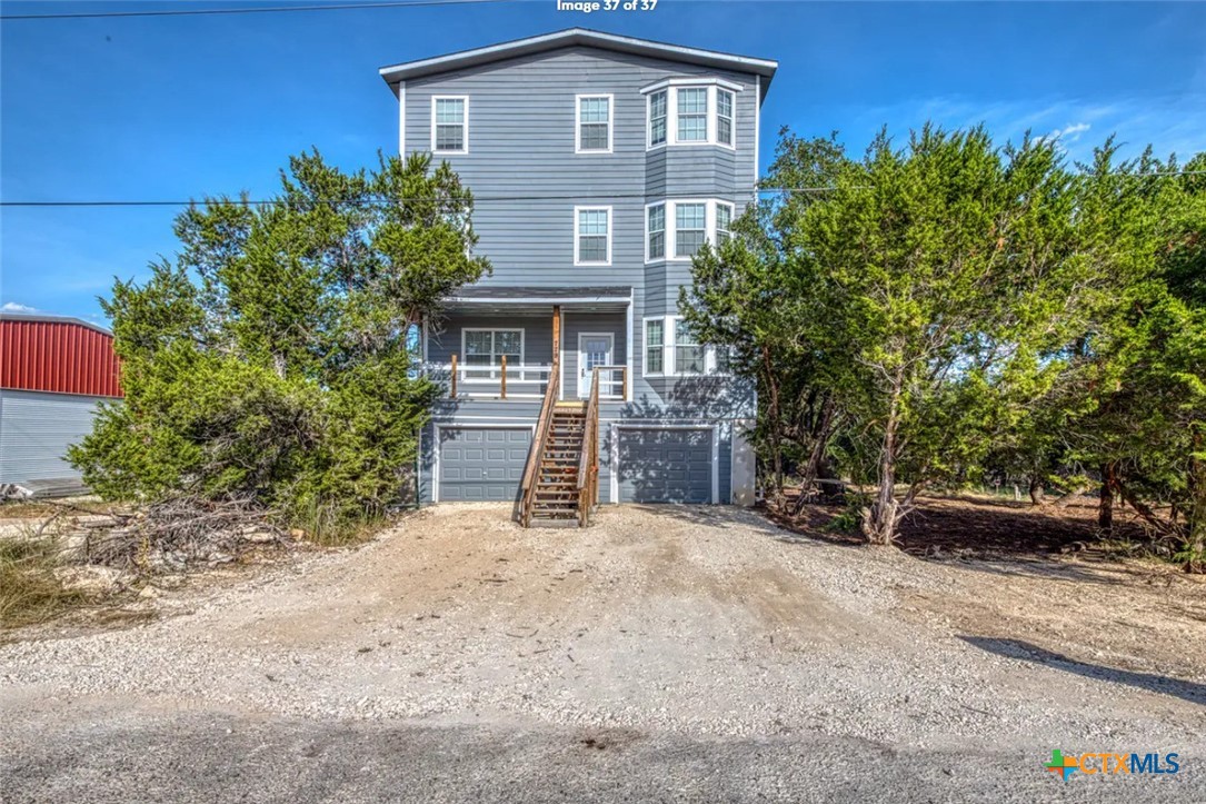 729 Clay Ridge Canyon Lake, TX 78133 - Photo 1 of 13 front view of a house with a yard