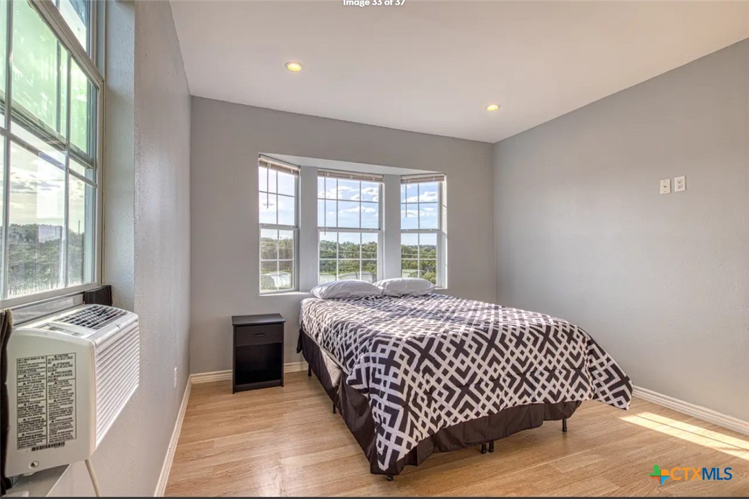 729 Clay Ridge Canyon Lake, TX 78133 - Photo 11 of 13 a bedroom with a bed and a window