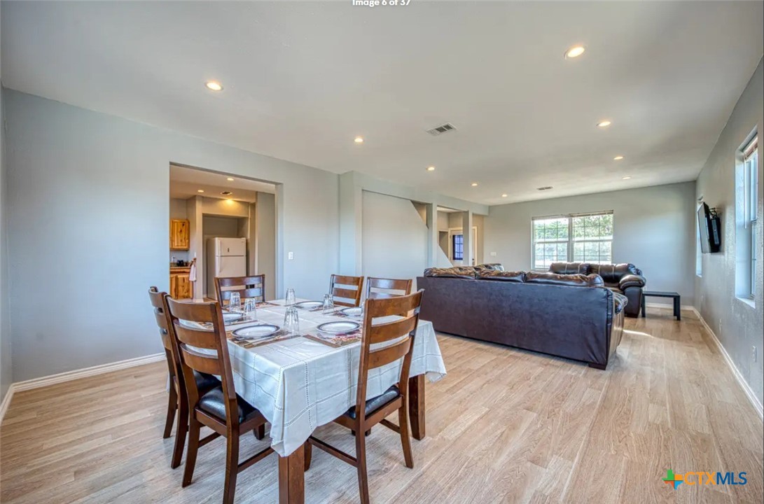 729 Clay Ridge Canyon Lake, TX 78133 - Photo 2 of 13 a living room with furniture and a wooden floor