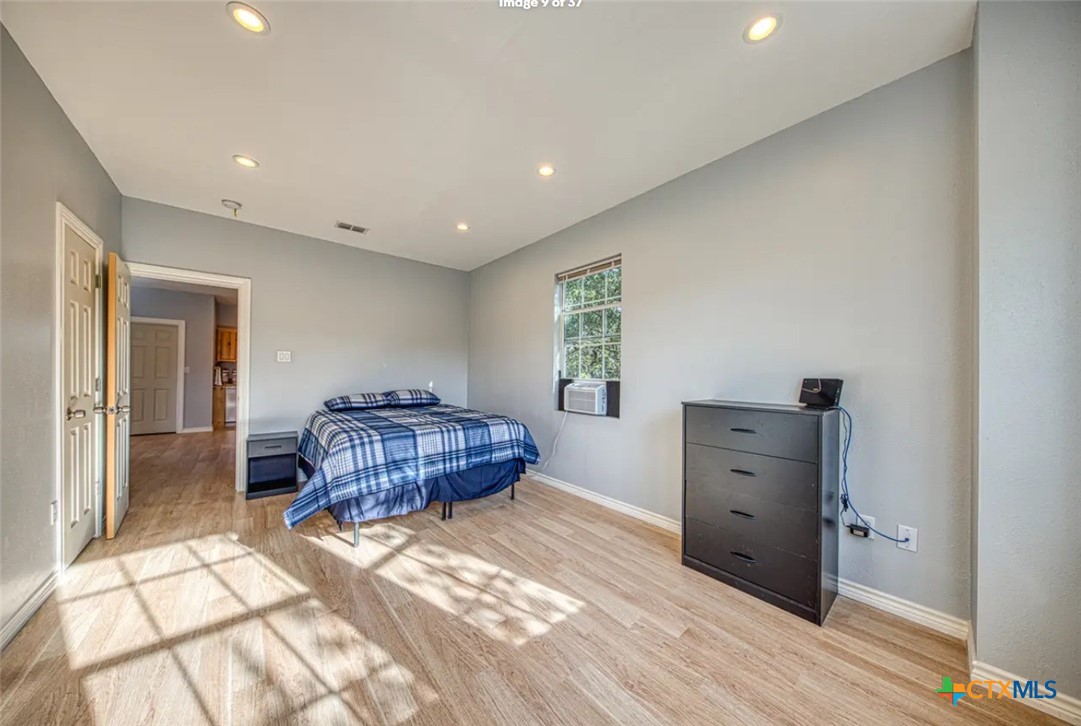 729 Clay Ridge Canyon Lake, TX 78133 - Photo 5 of 13 a bedroom with a bed and a dresser