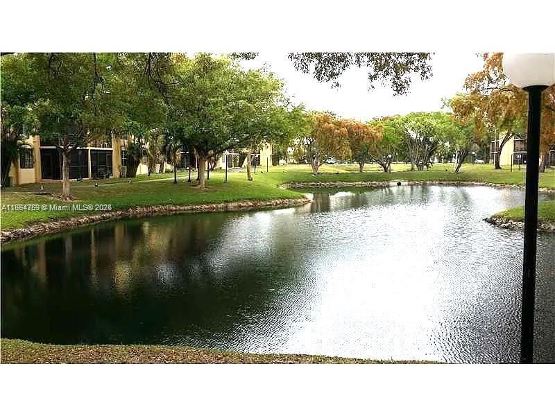 3253 Foxcroft Road, Unit G107 Miramar, FL 33025 - Photo 2 of 11 a black and white photo of a lake