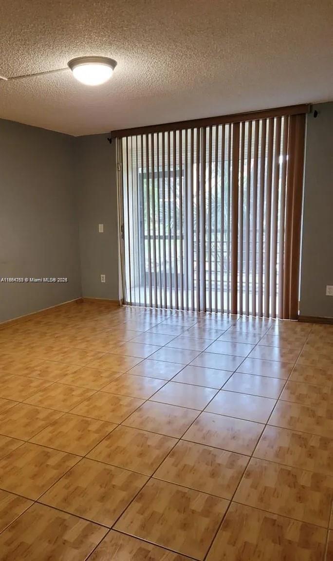 3253 Foxcroft Road, Unit G107 Miramar, FL 33025 - Photo 9 of 11 a view of a hallway