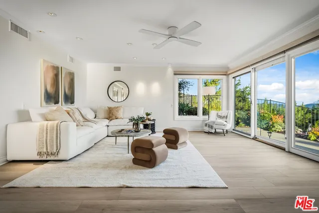 a view of a chairs and table in a window