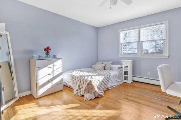 a workspace with furniture hardwood and a window