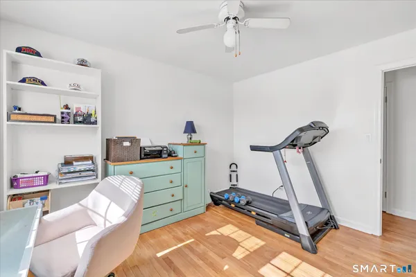 a view of a bedroom with wooden floor and bedroom