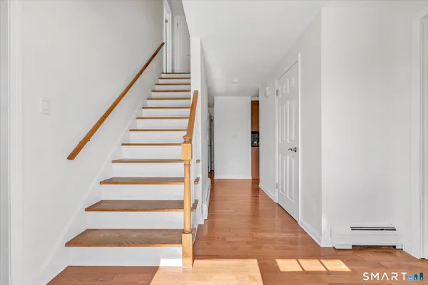 a view of entryway with wooden floor
