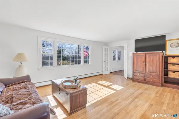 a living room with furniture and a flat screen tv