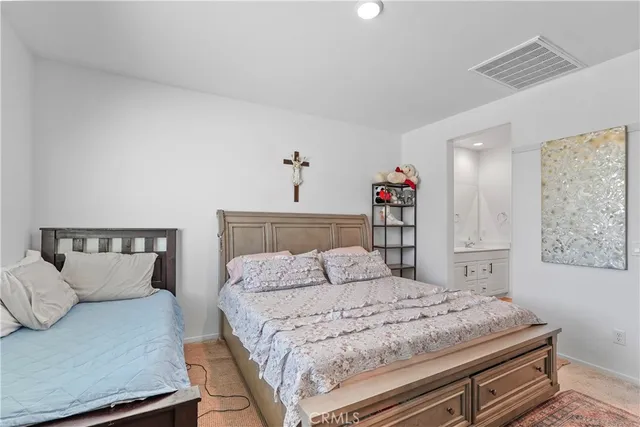 a bedroom with a bed and a dresser