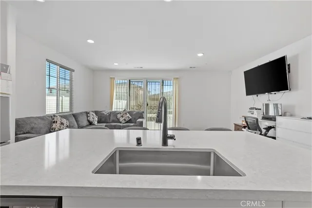 a kitchen with a sink and a large window