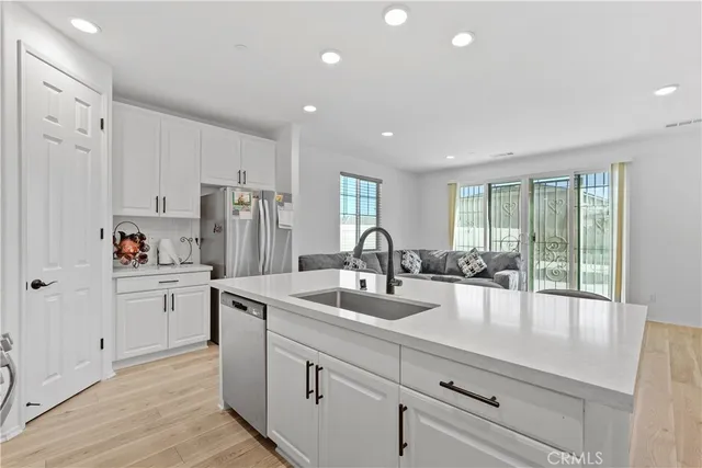 a kitchen with refrigerator and window