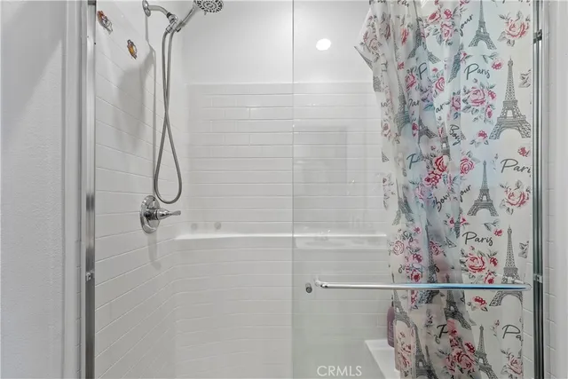 a bathroom with a shower curtain