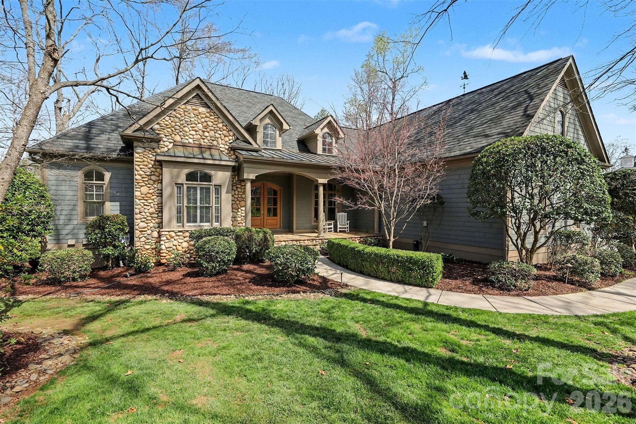 a front view of a house with a yard