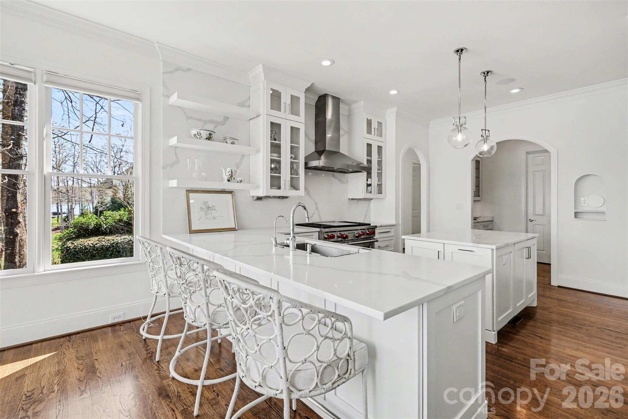 183 Mayfair Road Mooresville, NC 28117 - Photo 12 of 47 a large kitchen with stainless steel appliances a large center island attached withe living room