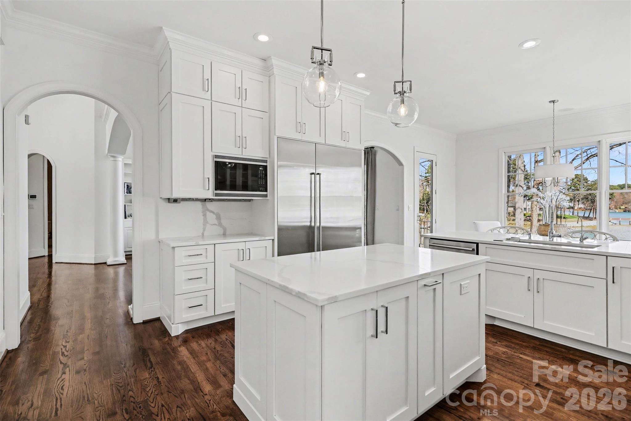 183 Mayfair Road Mooresville, NC 28117 - Photo 17 of 47 a kitchen with white cabinets and refrigerator