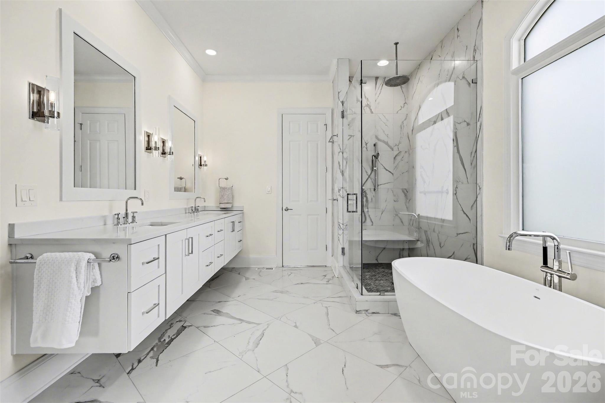183 Mayfair Road Mooresville, NC 28117 - Photo 26 of 47 a bathroom with a double vanity sink mirror double shower and a bathtub