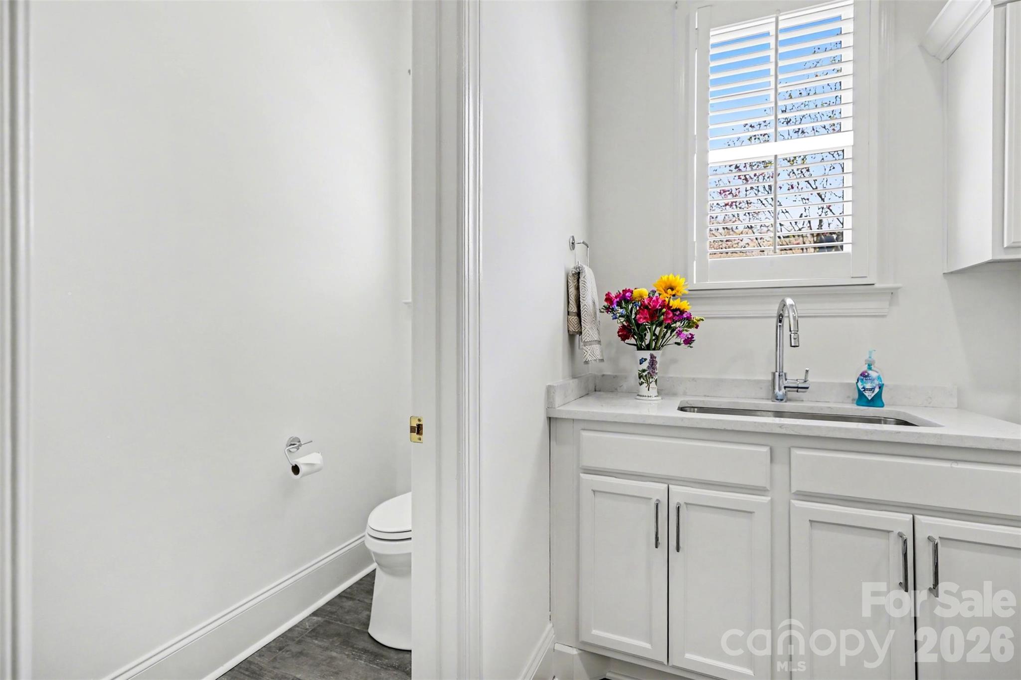 183 Mayfair Road Mooresville, NC 28117 - Photo 30 of 47 a bathroom with a toilet sink and mirror