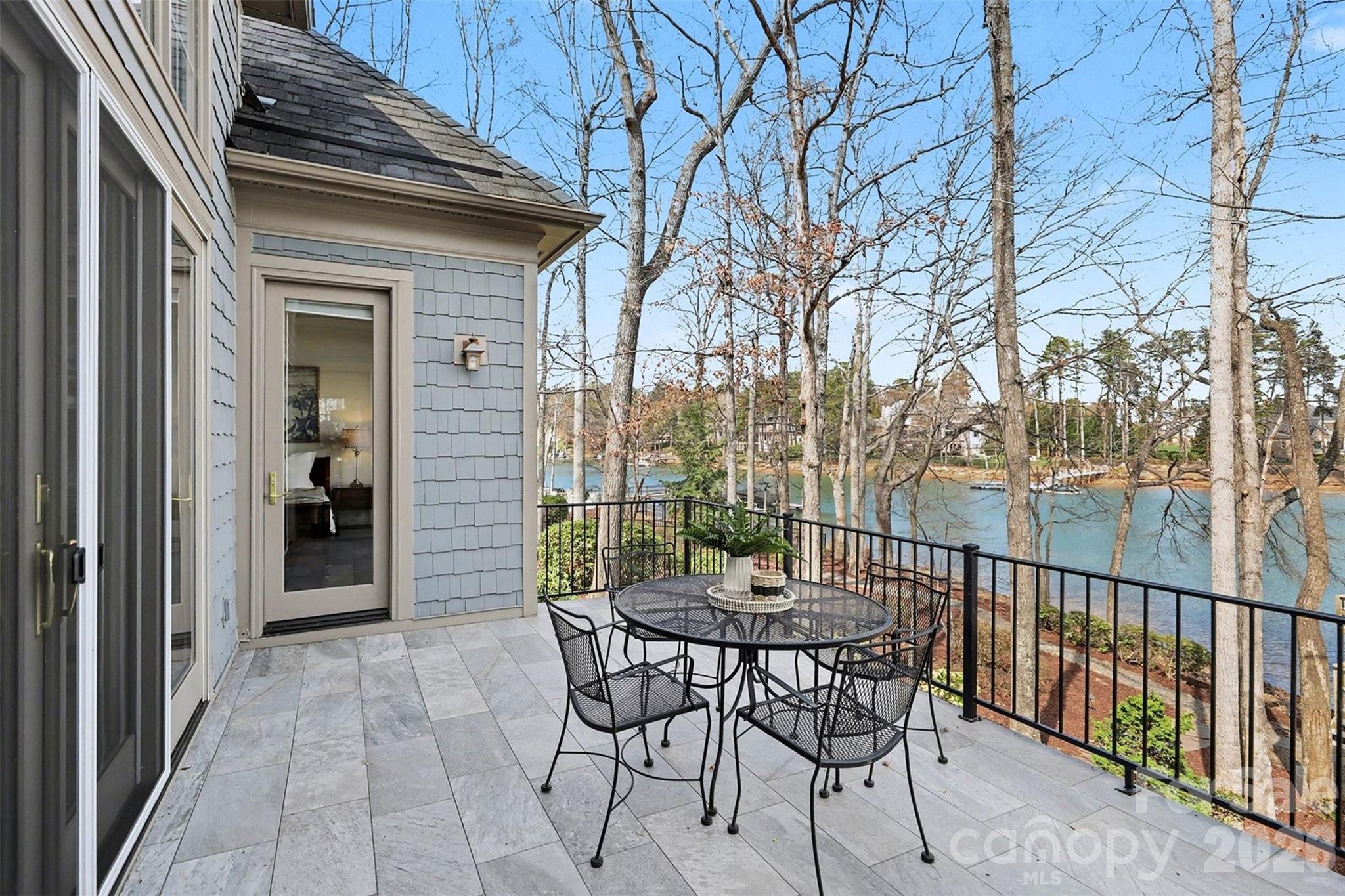 183 Mayfair Road Mooresville, NC 28117 - Photo 3 of 47 a view of a chairs and table in the balcony