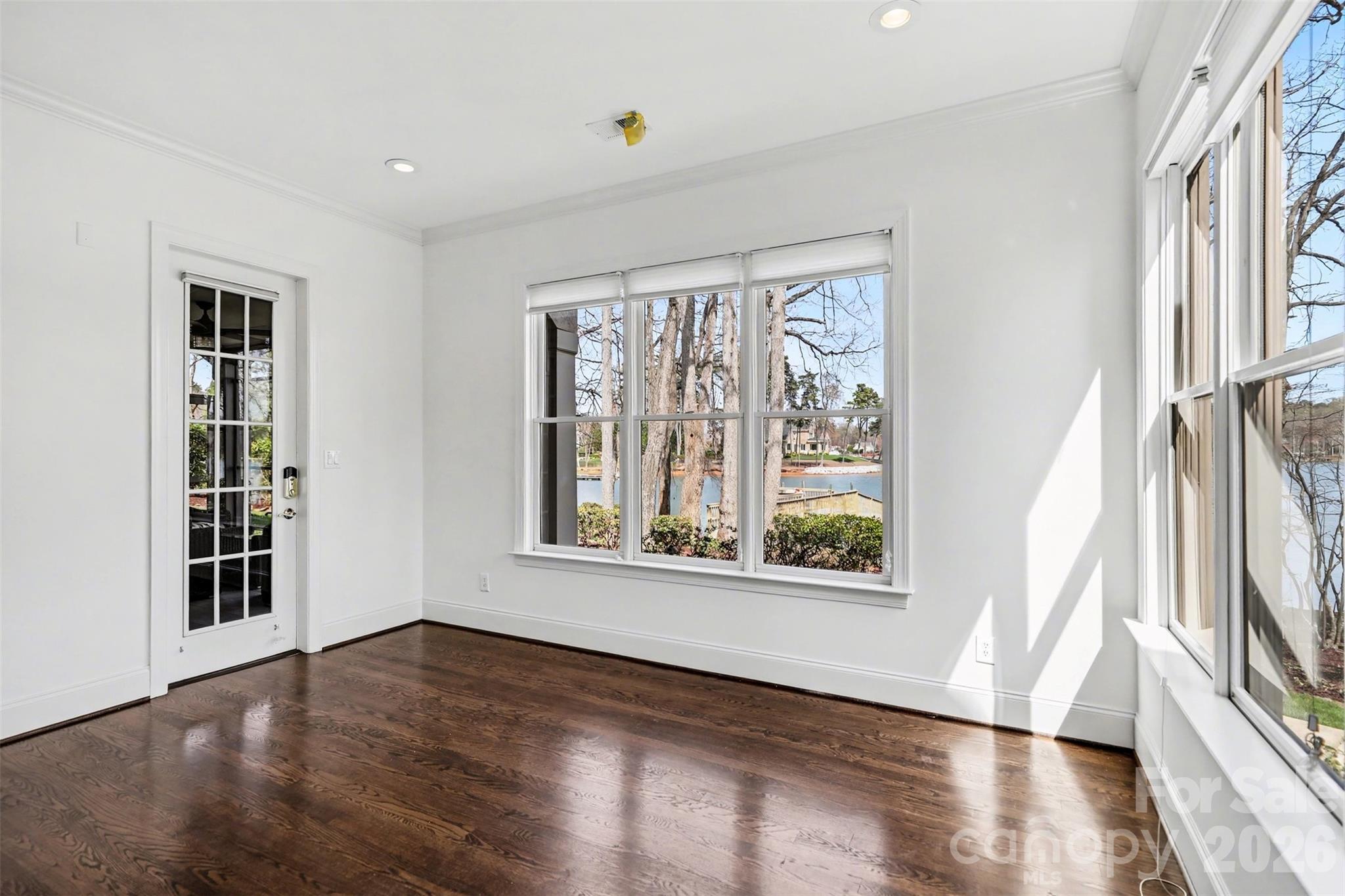 183 Mayfair Road Mooresville, NC 28117 - Photo 34 of 47 a view of an empty room with wooden floor and a window