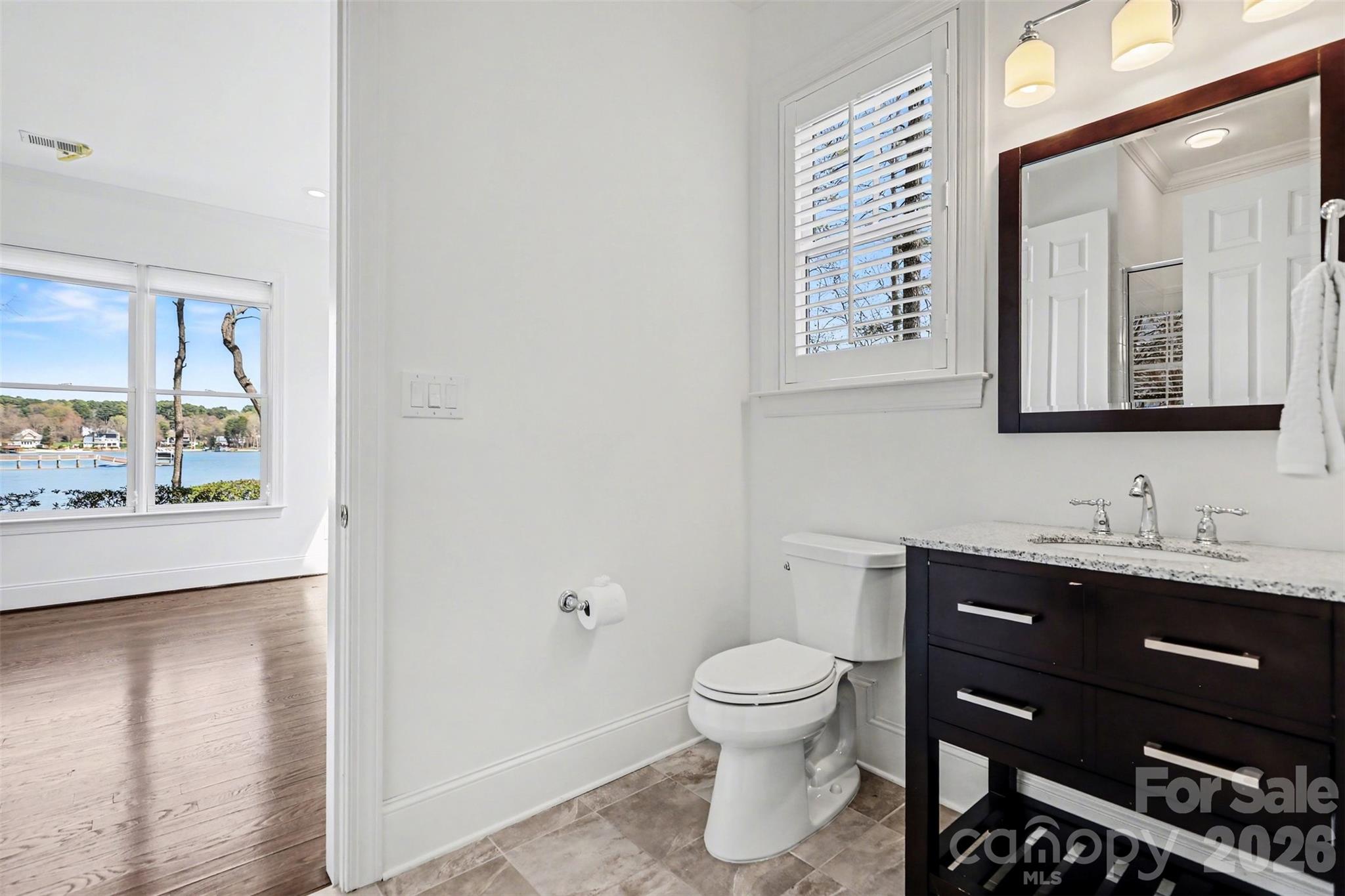 183 Mayfair Road Mooresville, NC 28117 - Photo 35 of 47 a bathroom with a toilet sink and mirror