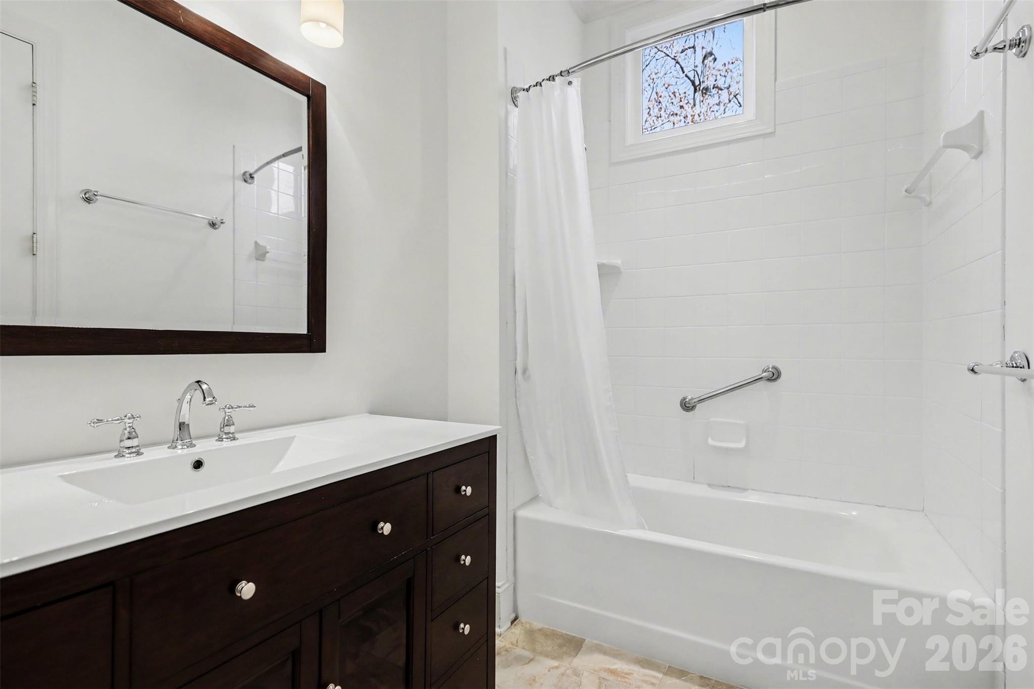 183 Mayfair Road Mooresville, NC 28117 - Photo 42 of 47 a bathroom with a bathtub sink vanity and mirror