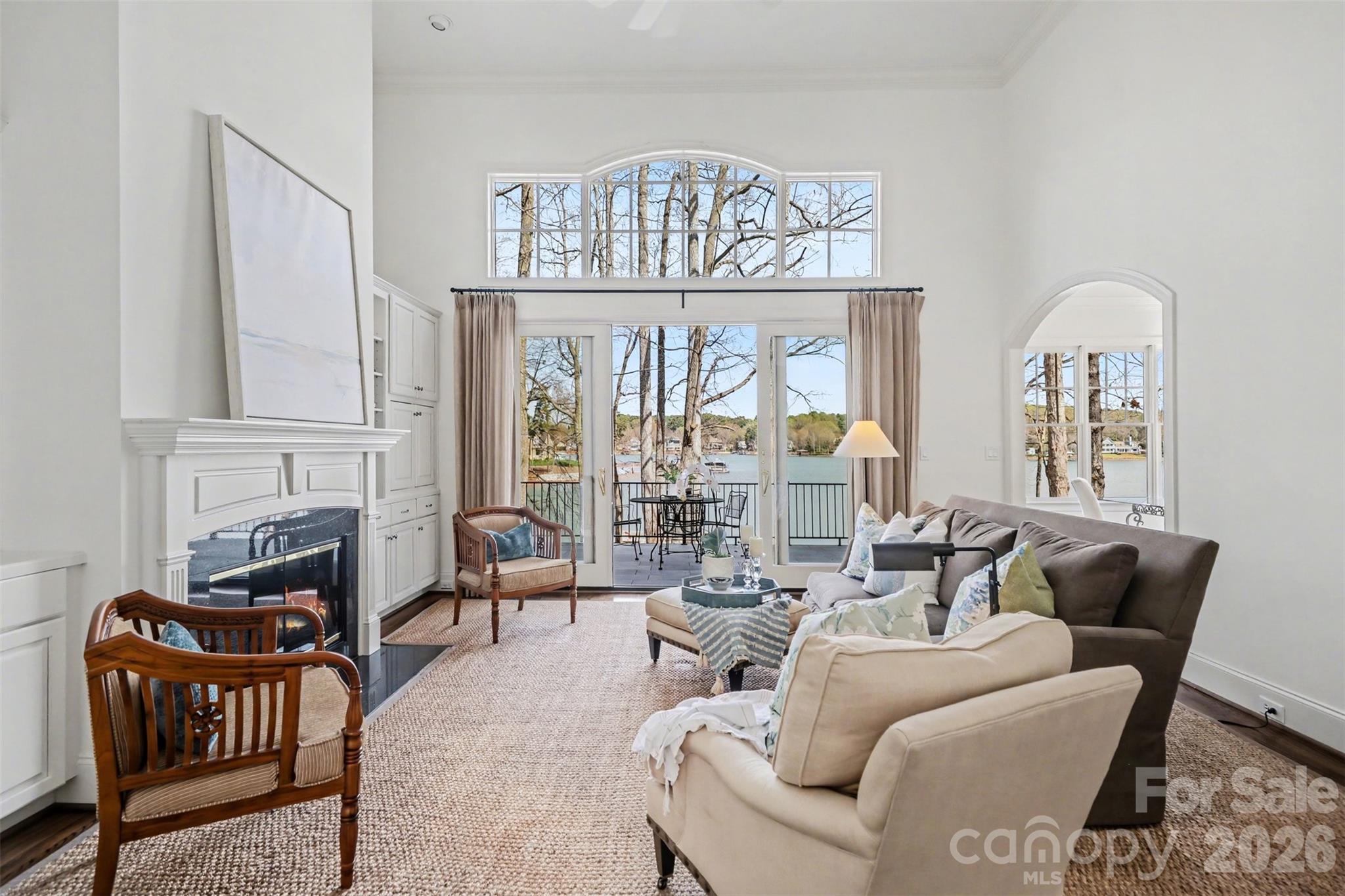 183 Mayfair Road Mooresville, NC 28117 - Photo 5 of 47 a living room with furniture a fireplace and a chandelier