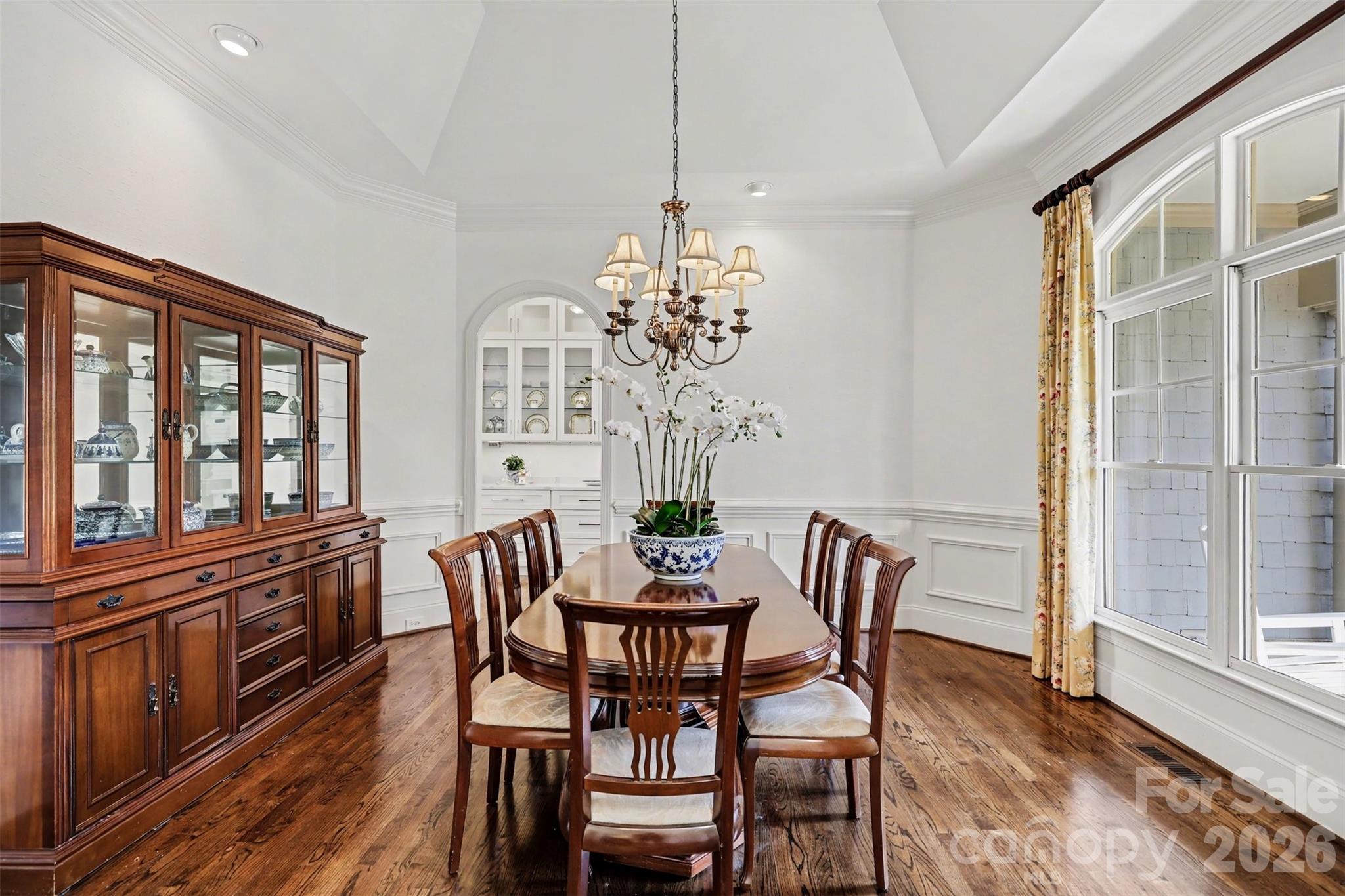 183 Mayfair Road Mooresville, NC 28117 - Photo 9 of 47 a dining room with furniture a chandelier and wooden floor