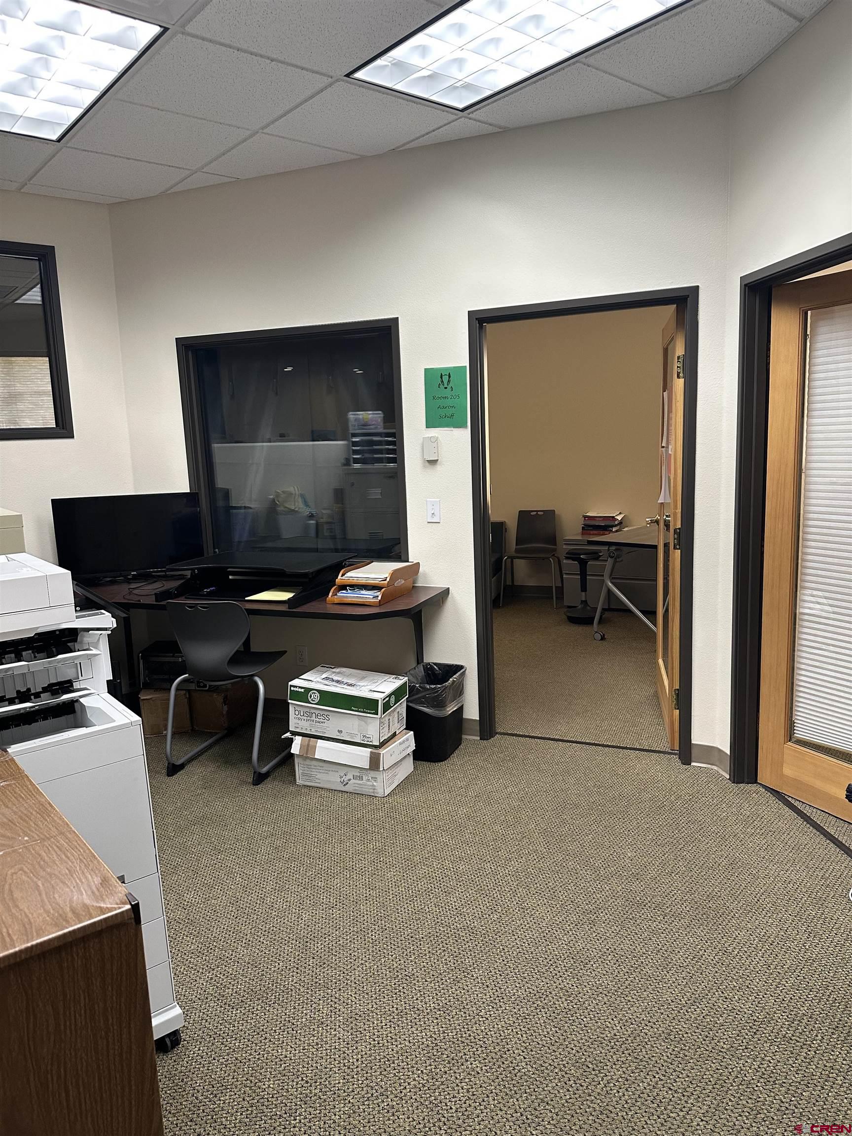 150 Tech Center Drive, Unit A Durango, CO 81301 - Photo 5 of 6 a living room with furniture and a flat screen tv
