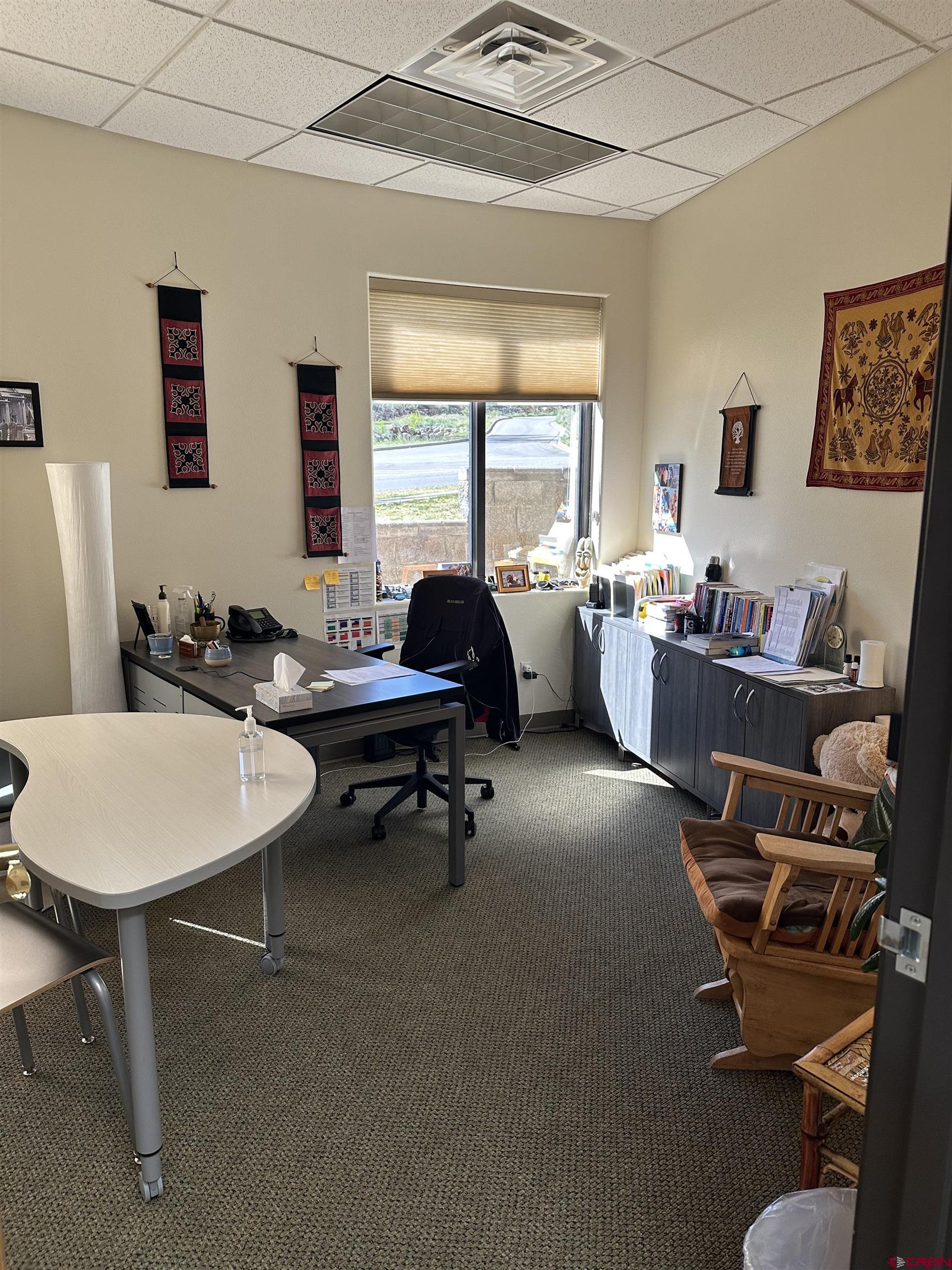 150 Tech Center Drive, Unit A Durango, CO 81301 - Photo 6 of 6 a living room with furniture a window and a table