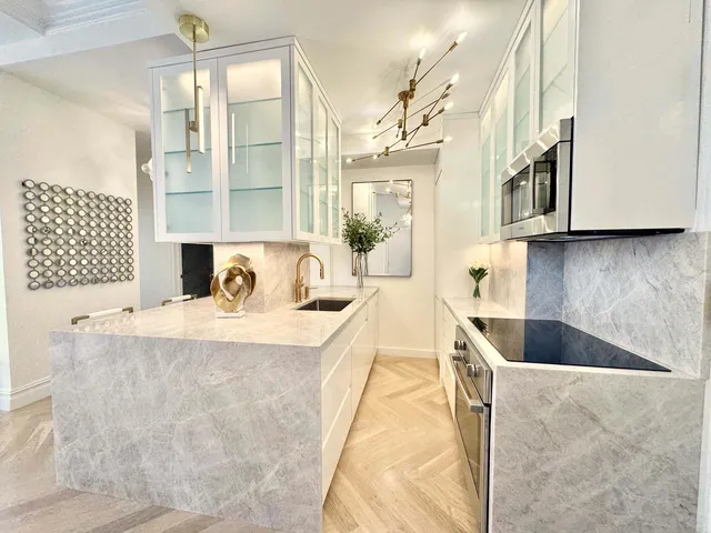 a living room with granite countertop furniture and a fireplace