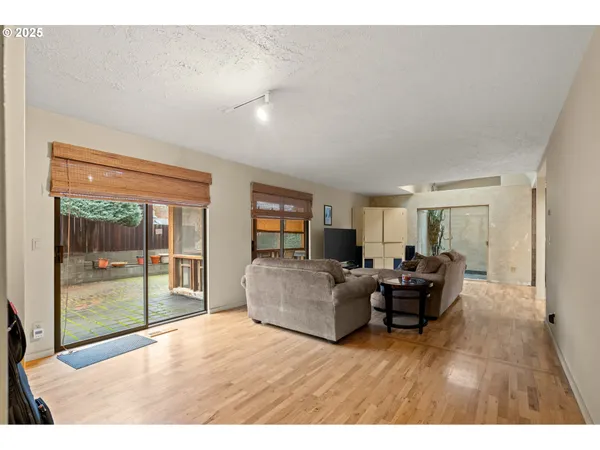 a living room with furniture a couch and a flat screen tv