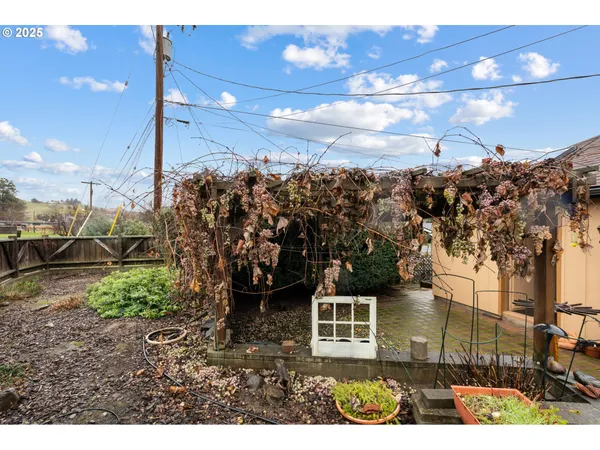 a view of a pathway of a house with a yard