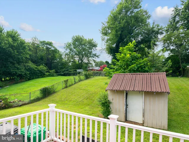 a view of a wooden deck and garden