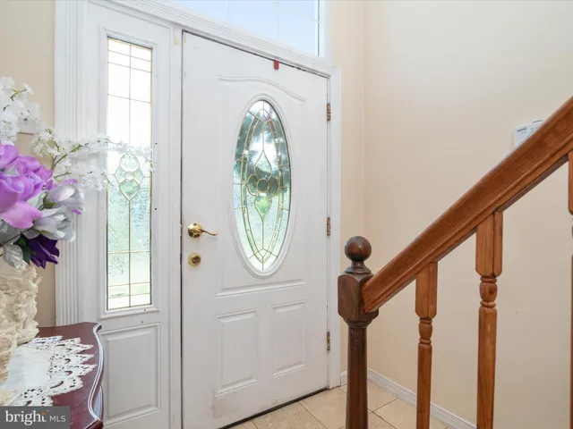 a view of a livingroom with furniture and a window