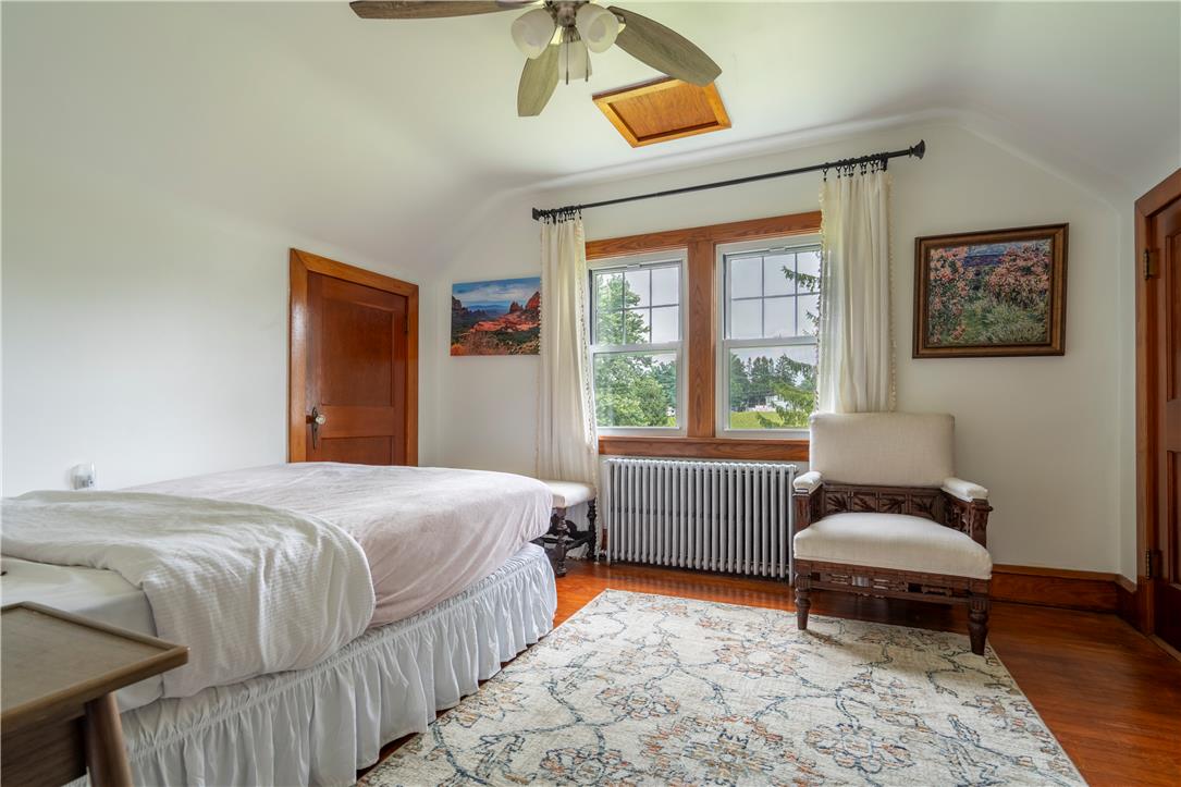 665 Point Phillips Road Bath, PA 18014 - Photo 38 of 73 Hardwood flooring and multiple windows create a comfortable and naturally illuminated bedroom retreat.