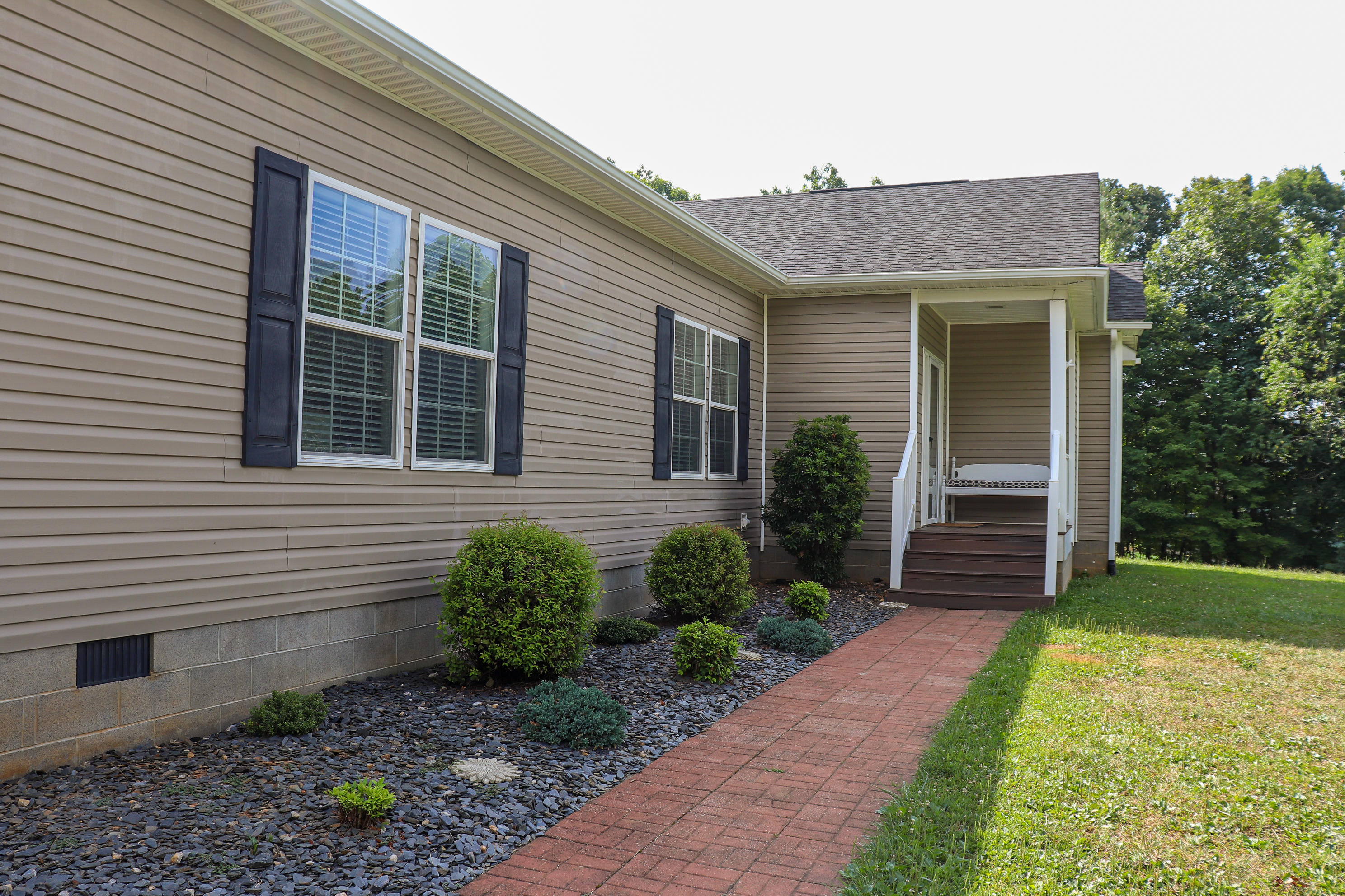 241 Sams Road Southeast Floyd, VA 24091 - Photo 3 of 28 a front view of a house with garden