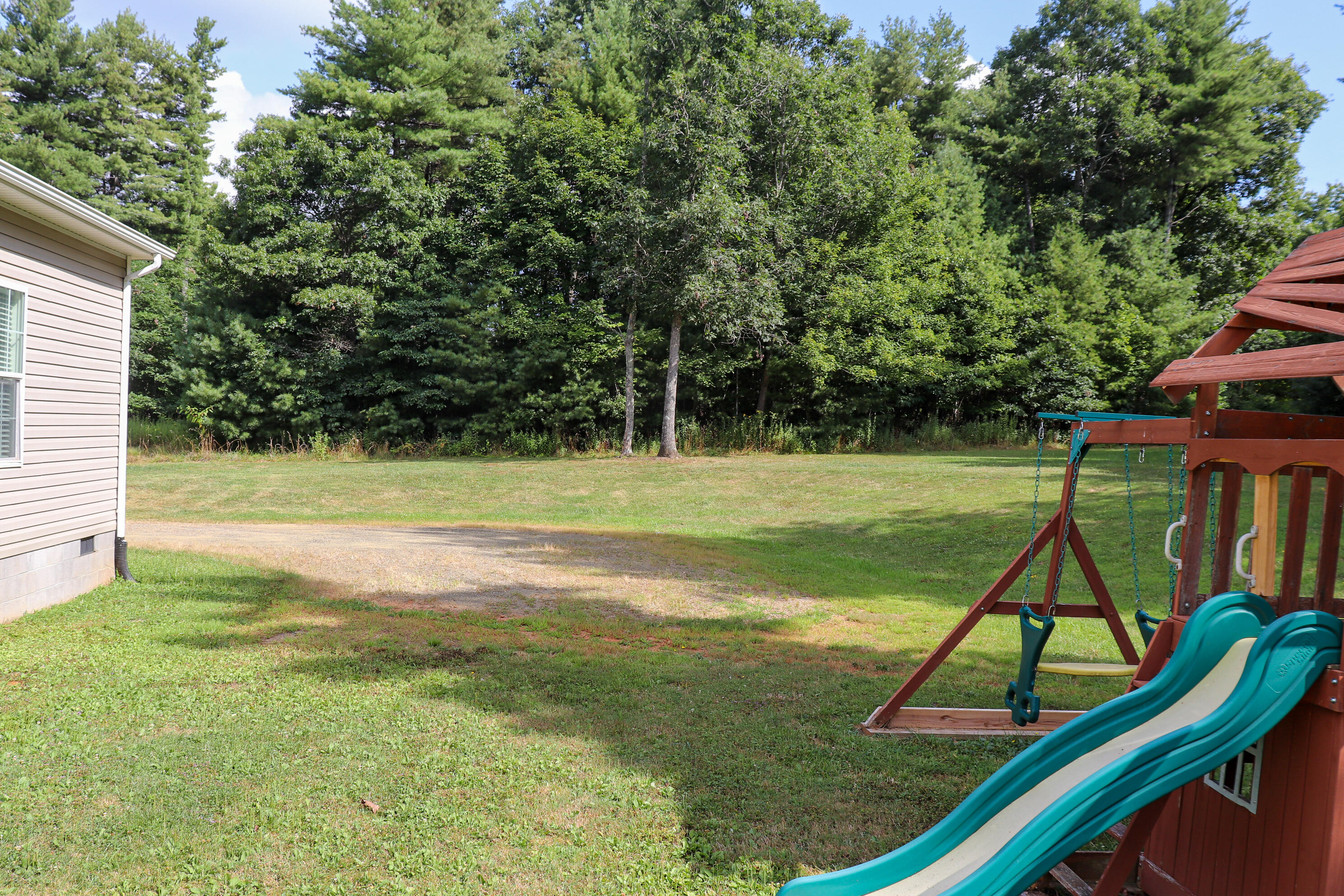 241 Sams Road Southeast Floyd, VA 24091 - Photo 24 of 28 a view of a house with a backyard