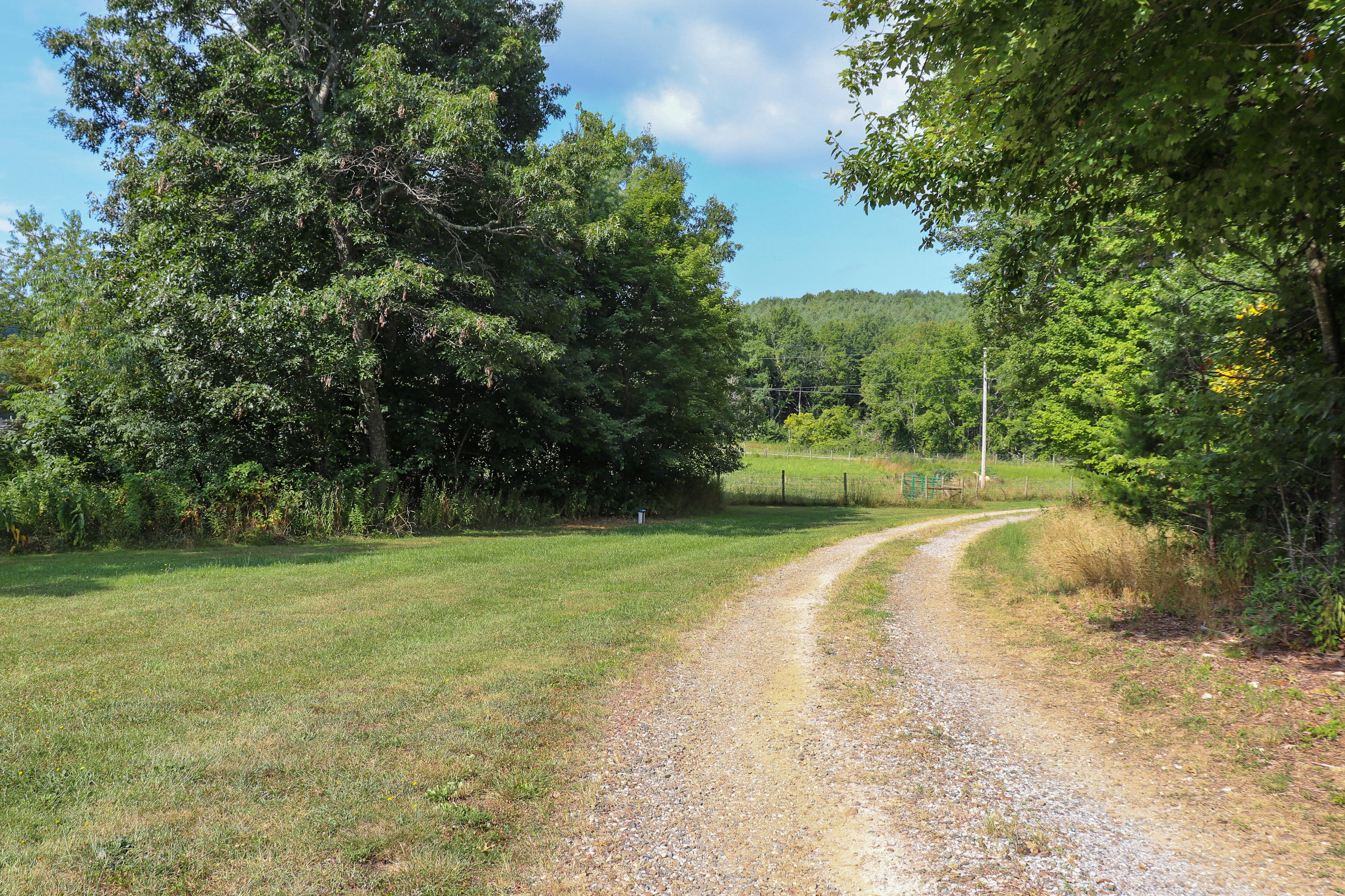 241 Sams Road Southeast Floyd, VA 24091 - Photo 28 of 28 a view of a field with trees in the background