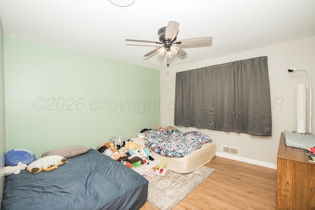3609 Patterson Drive Amarillo, TX 79109 - Photo 16 of 21 a bedroom with a bed and a window