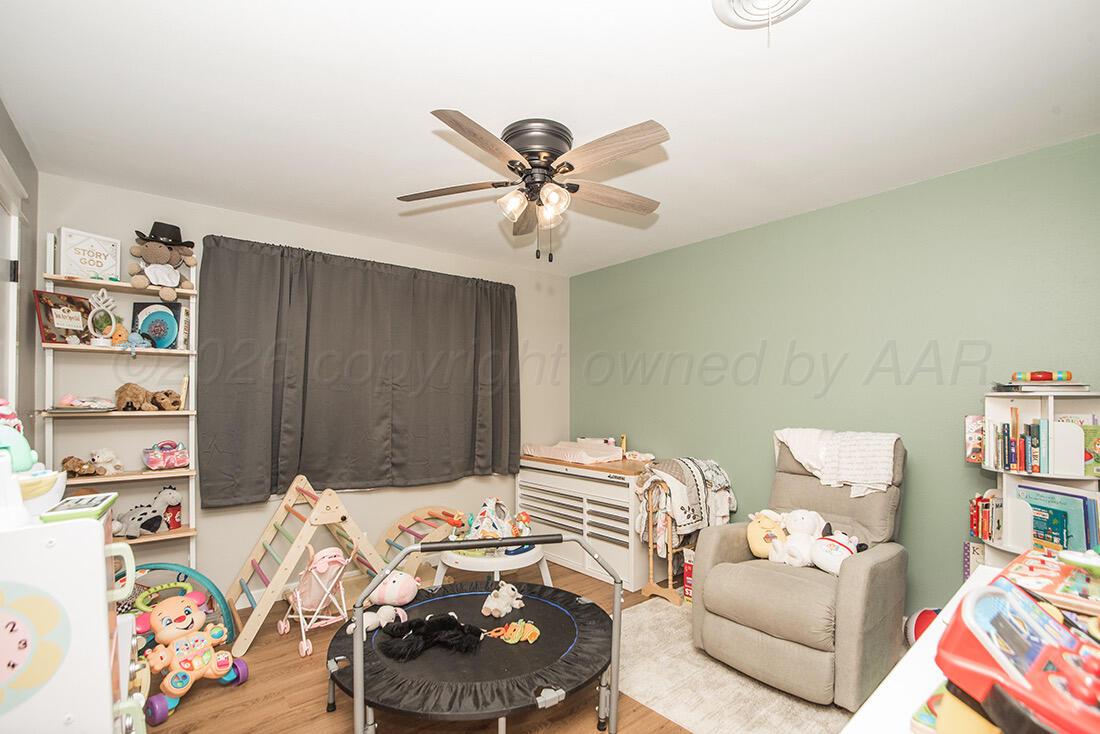 3609 Patterson Drive Amarillo, TX 79109 - Photo 19 of 21 a bedroom with a bed and a couch