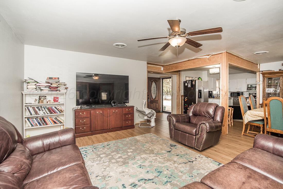 3609 Patterson Drive Amarillo, TX 79109 - Photo 5 of 21 a living room with furniture and a flat screen tv
