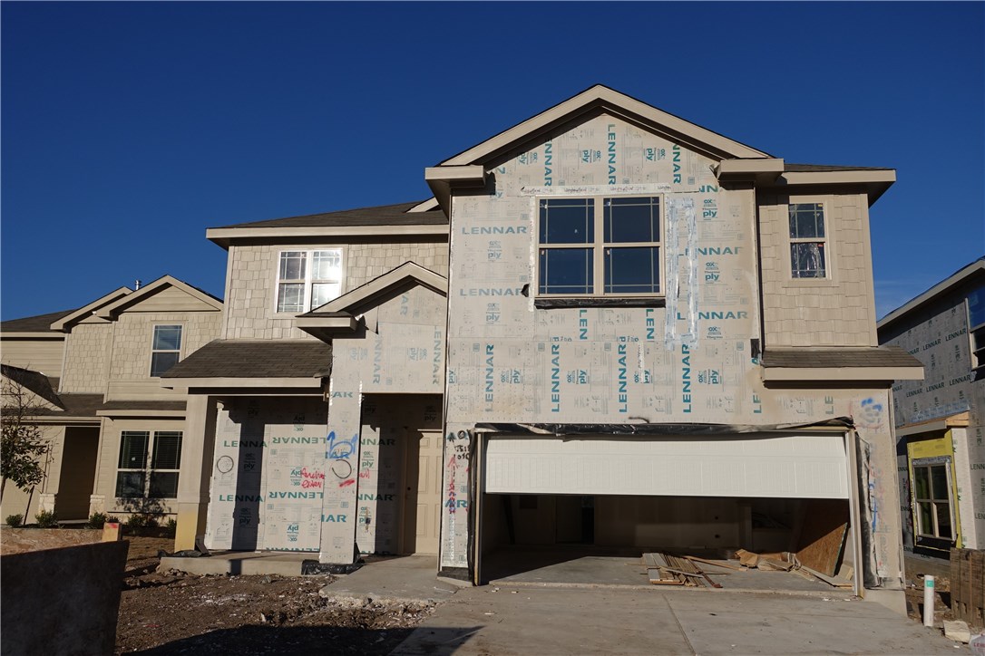 6900 Vail Ridge Street Austin, TX 78744 - Photo 1 of 1 a front view of a house with garage