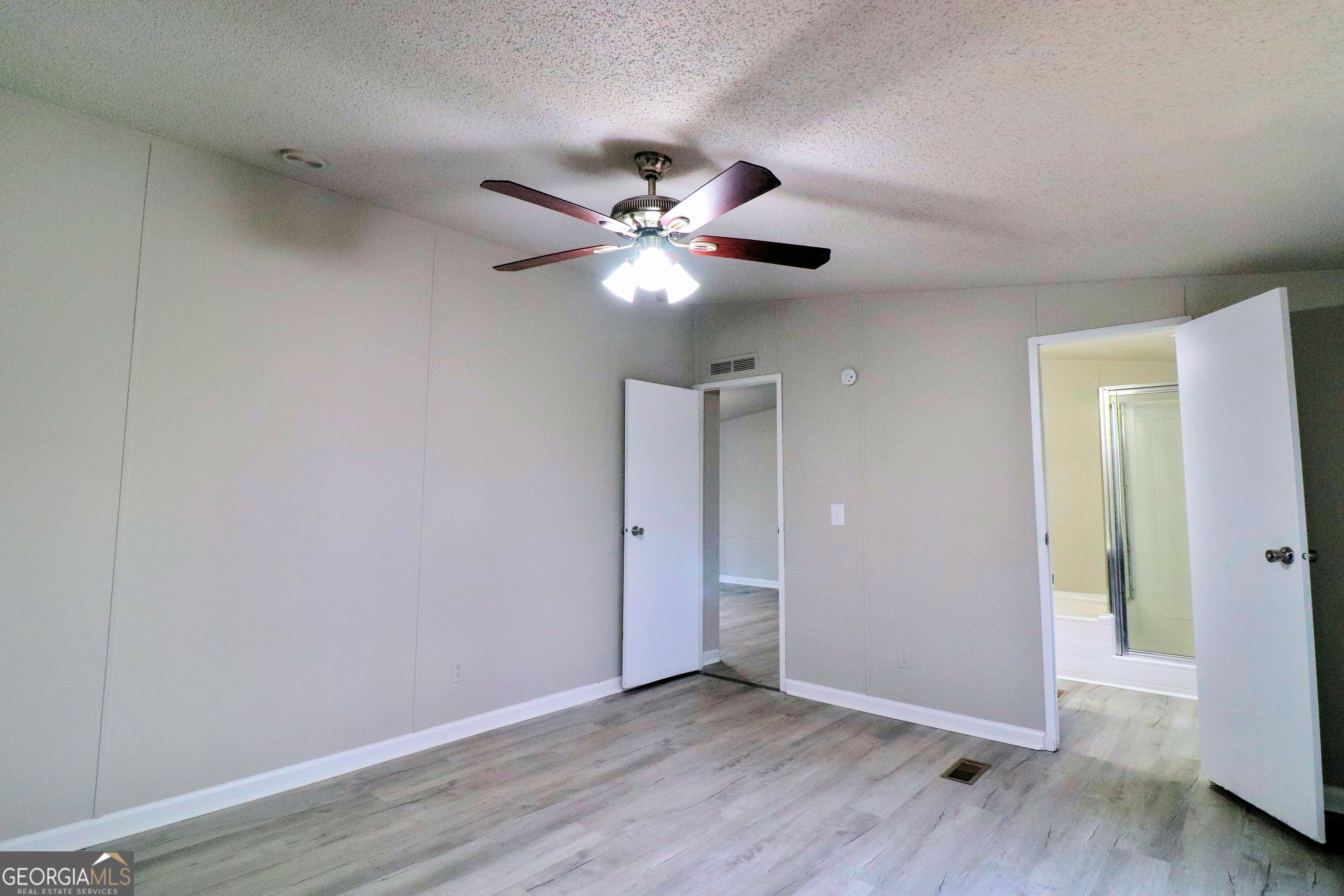 2200 Ridgeside Drive Villa Rica, GA 30180 - Photo 19 of 32 a view of an empty room with wooden floor